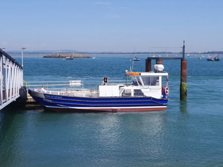 The Pride of Hayling moored at the Eastney pontoon, looking across Langstone Harbour towards Hayling Island