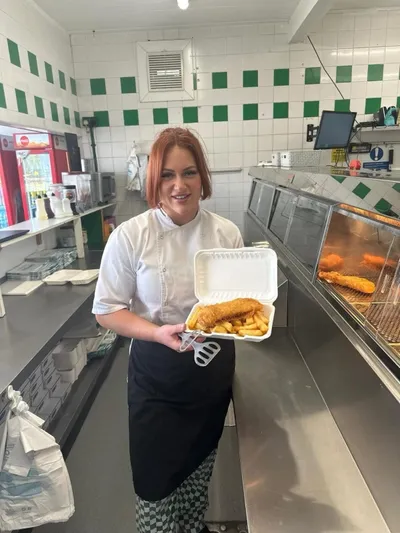 Whistler's staff meber with a tray of fish and chips